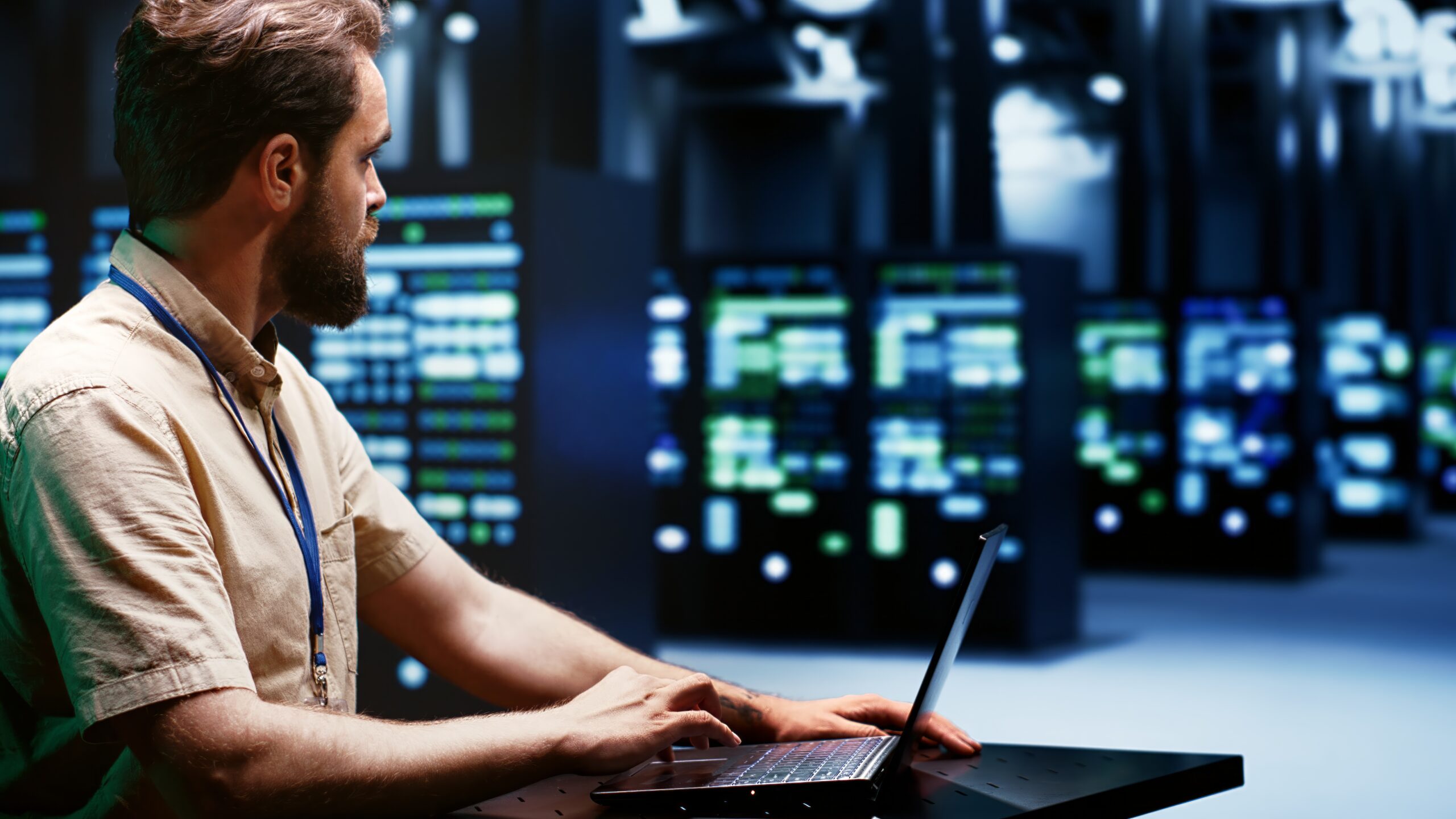 System administrator typing supercomputer hub disaster recovery plan on laptop to provide fast restoration of service, limiting damage and minimizing interruptions to normal operations