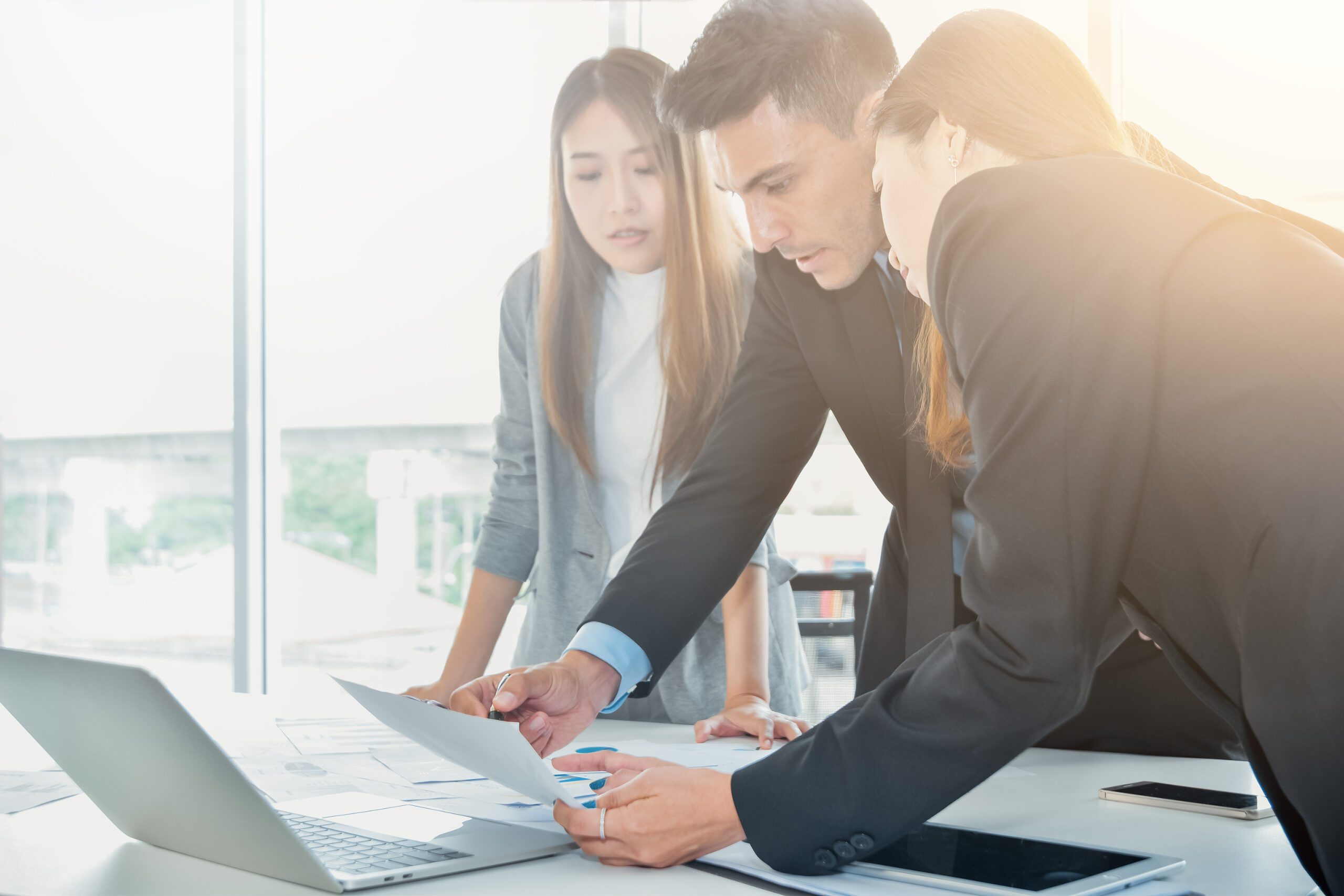 Business Team concept ,Business people brainstorm or discussing the document or finance report charts and graphs on office desk.