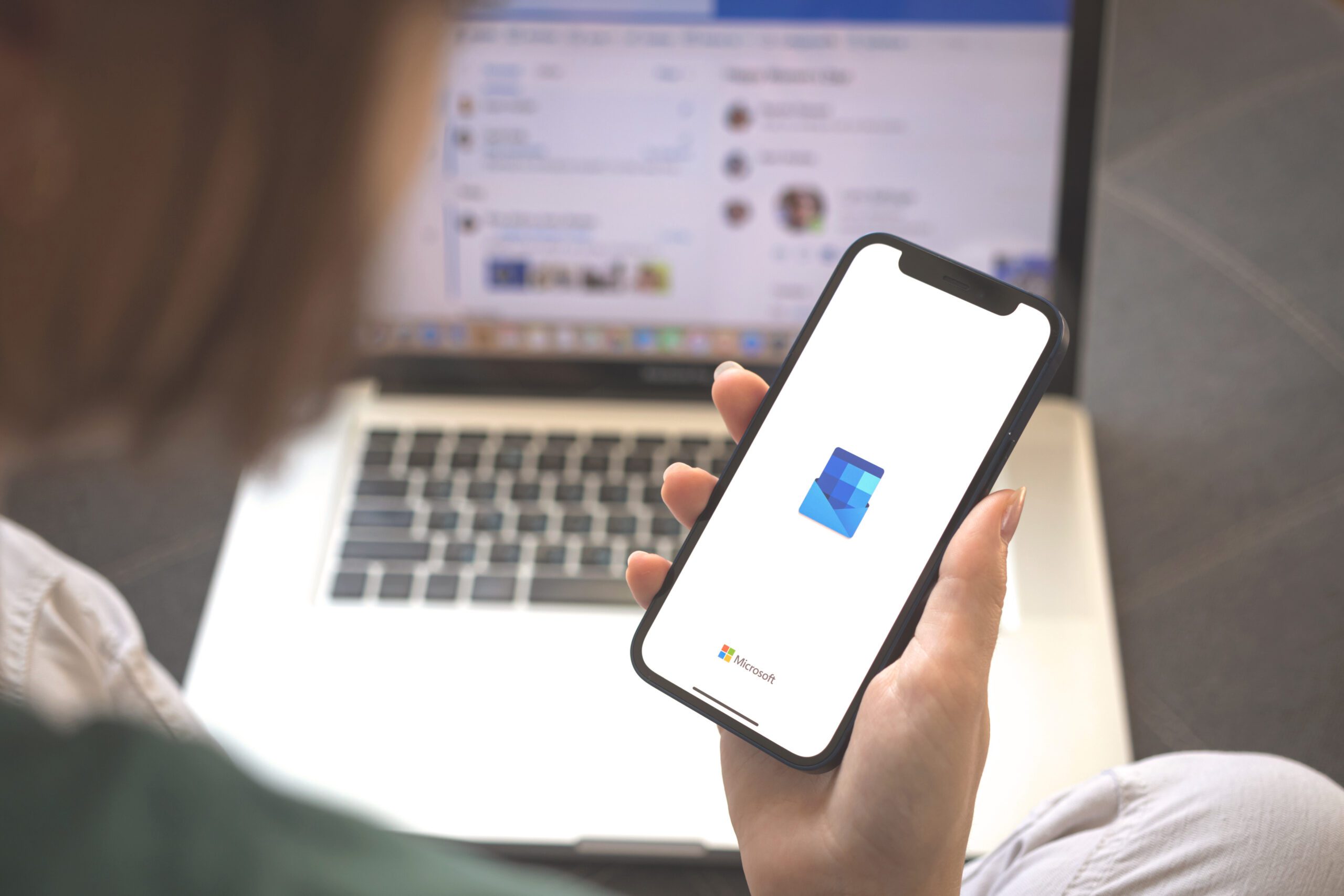 Kharkov, Ukraine - August 23, 2021: Woman using Microsoft Outlook application, closeup